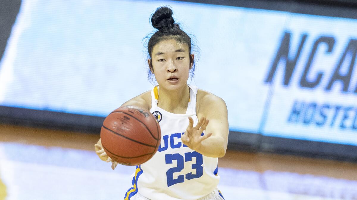 UCLA guard Natalie Chou passes during a game against Wyoming.