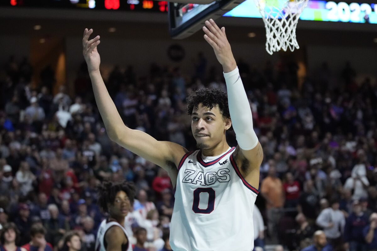 Gonzaga's Julian Strawther (0) celebrates as his team leads Saint Mary's with seconds left during the second half of an NCAA college basketball championship game at the West Coast Conference tournament Tuesday, March 8, 2022, in Las Vegas. (AP Photo/John Locher)