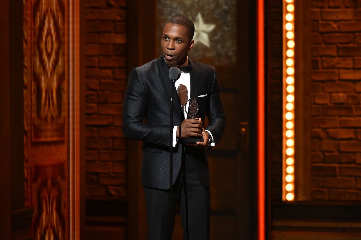 Actor Leslie Odom Jr. accepts the award for Best Performance by an Actor in a Leading Role in a Musical in "Hamilton" onstage during the 70th Annual Tony Awards at The Beacon Theatre on June 12 in New York City.