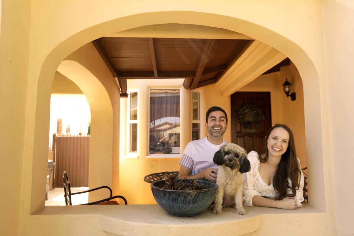 Devin Sunseri, Katie Scardino and their dog Tallulah at their home in Leimert Park.