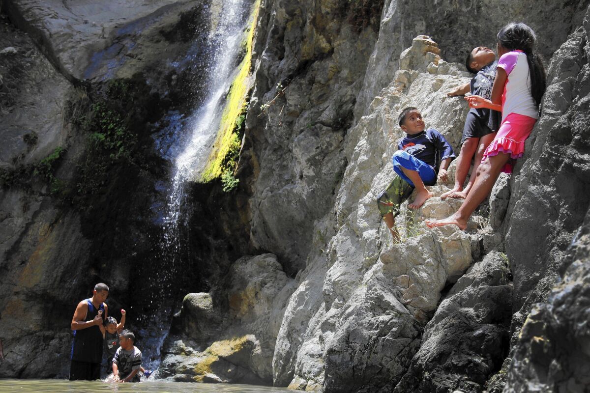 Children play at Eaton Canyon Falls in the Angeles National Forest.