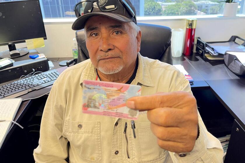 Ricardo Rodriguez shows his work permit. He also got his lawful permanent resident card, which gives him the right to live, work and travel outside the United States. He will be able to apply for citizenship after five years, in. Los Angeles on March 24, 2023.
