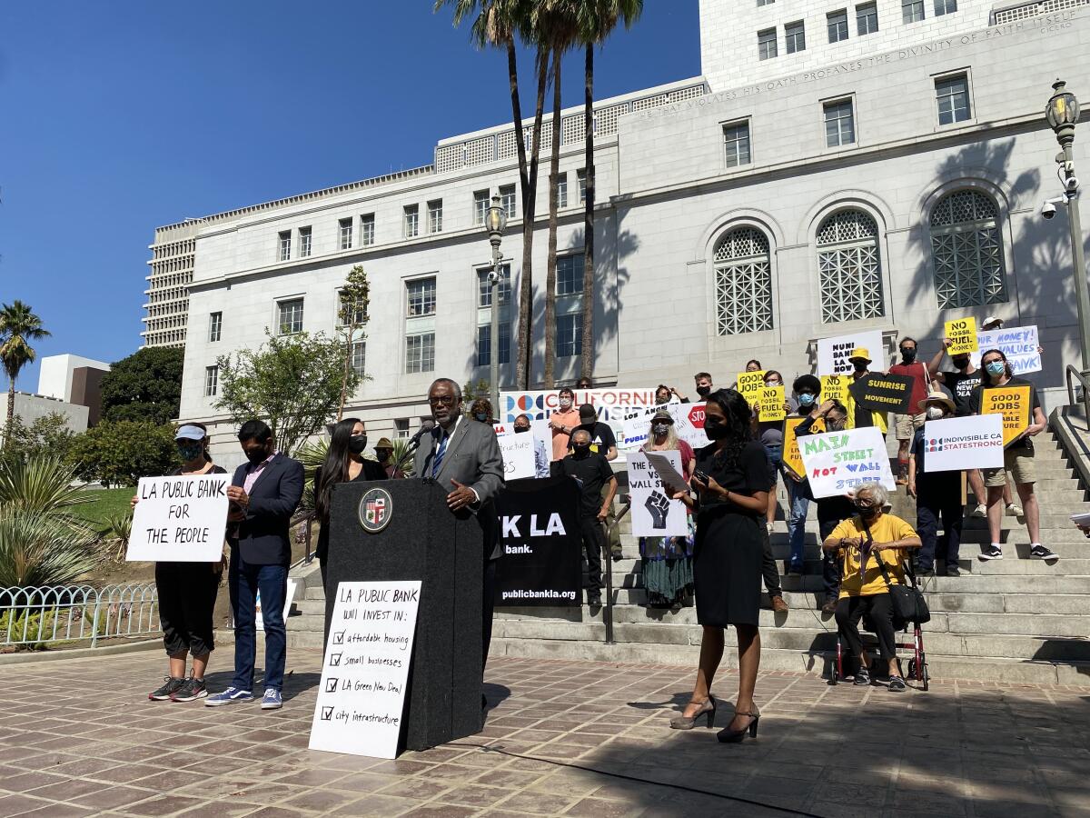 L.A. City Councilman Curren Price speaks outside City Hall