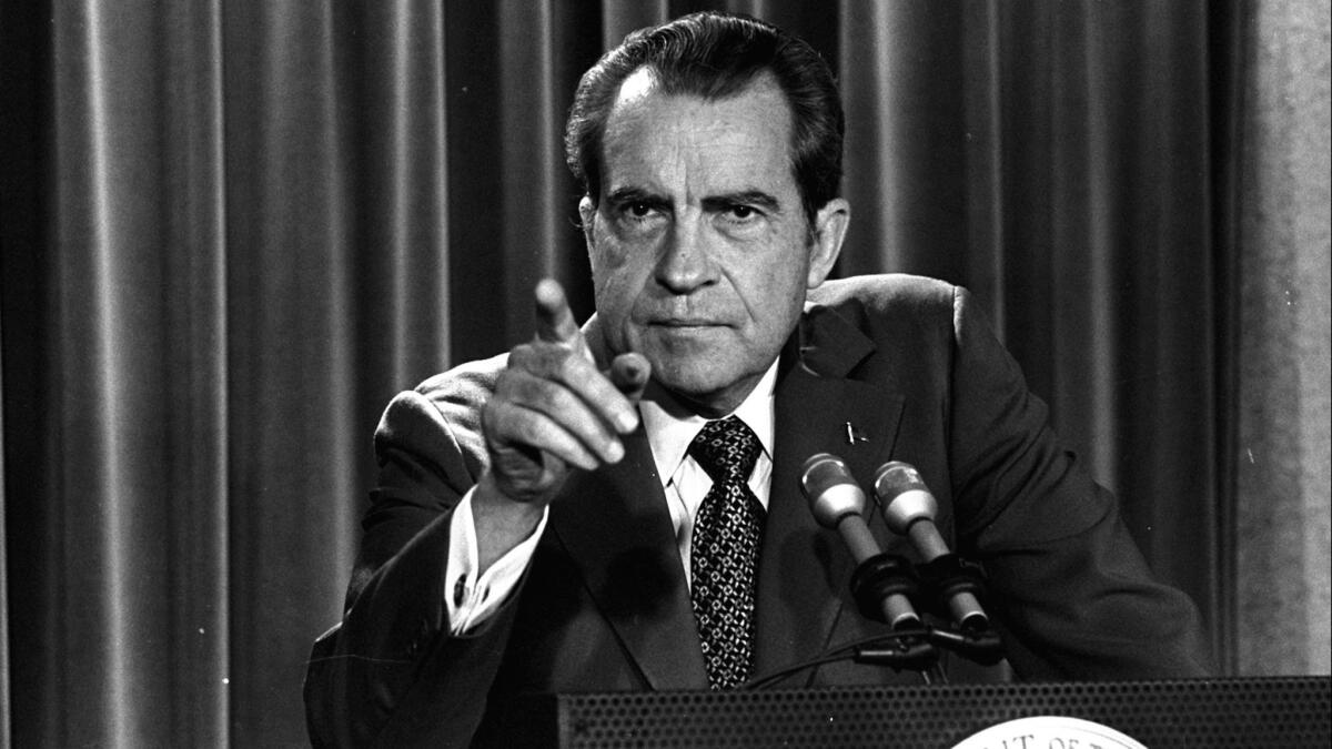 President Nixon holds a news conference to say that he will not allow his legal counsel to testify in the Watergate investigation in Washington on March 15, 1973.