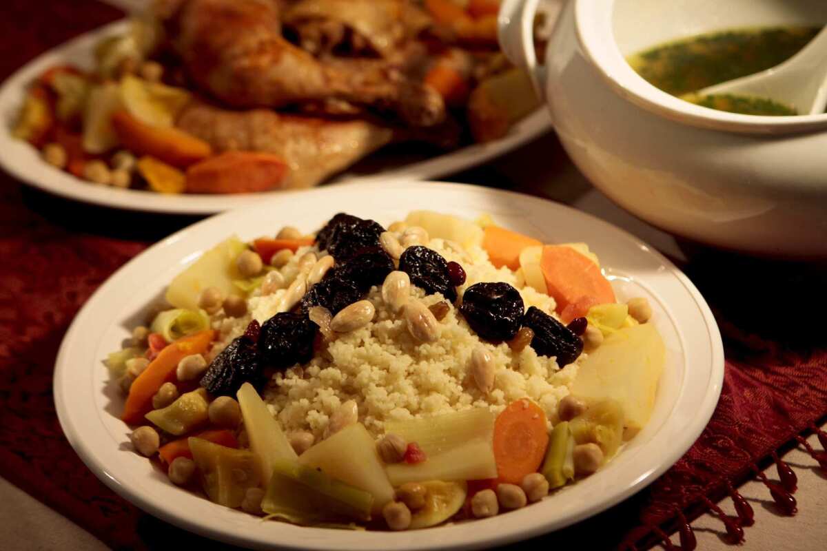 Quick coucous with dried fruit and almond garnish.