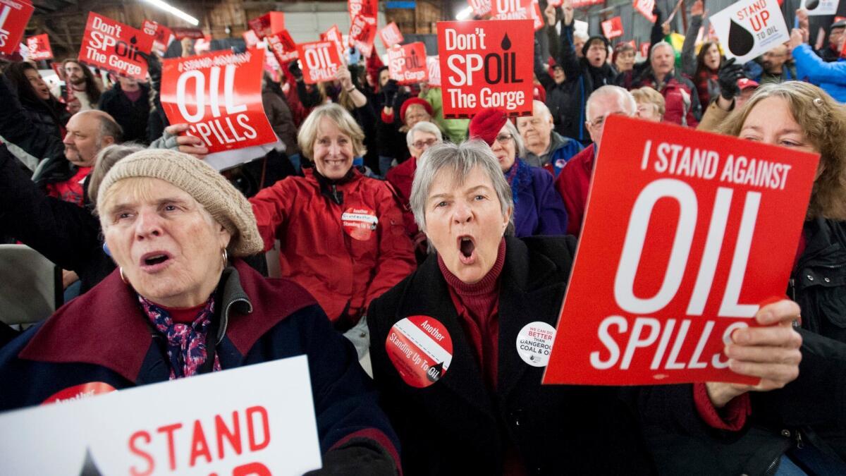 Opponents of a proposed oil-handling facility along the Columbia River in Washington state make their feelings known at a public hearing in January 2016. The state last week rejected the project.