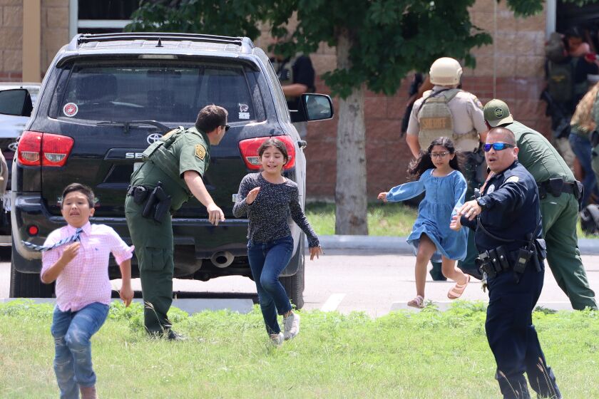 In a photo taken by Pete Luna, general manager of the Uvlade Leader-News terrified children are seen running from Robb Elementary during the school shooting on Tuesday, April 24, 2022. NO HANDOUT / NO SALES / MANDATORY CREDIT PETE LUNA / UVALDE LEADER-NEWS