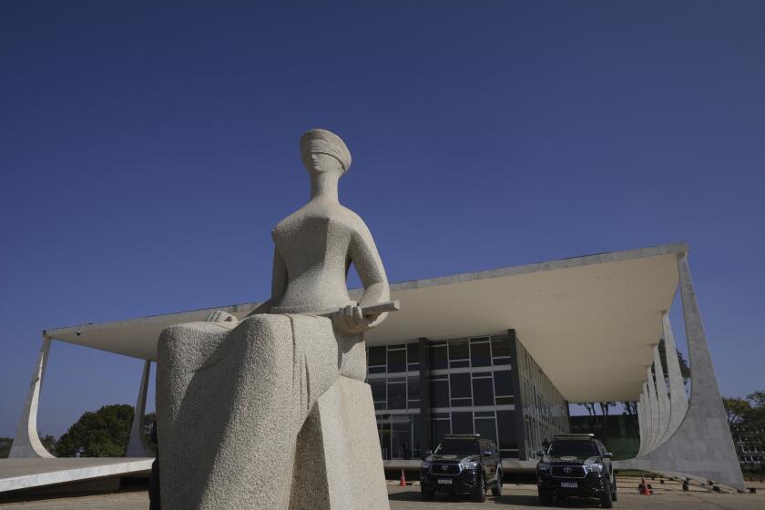 Lady Justice stands outside the Supreme Court in Brasilia, Brazil, Monday, Sept. 2, 2024. (AP Photo/Eraldo Peres)