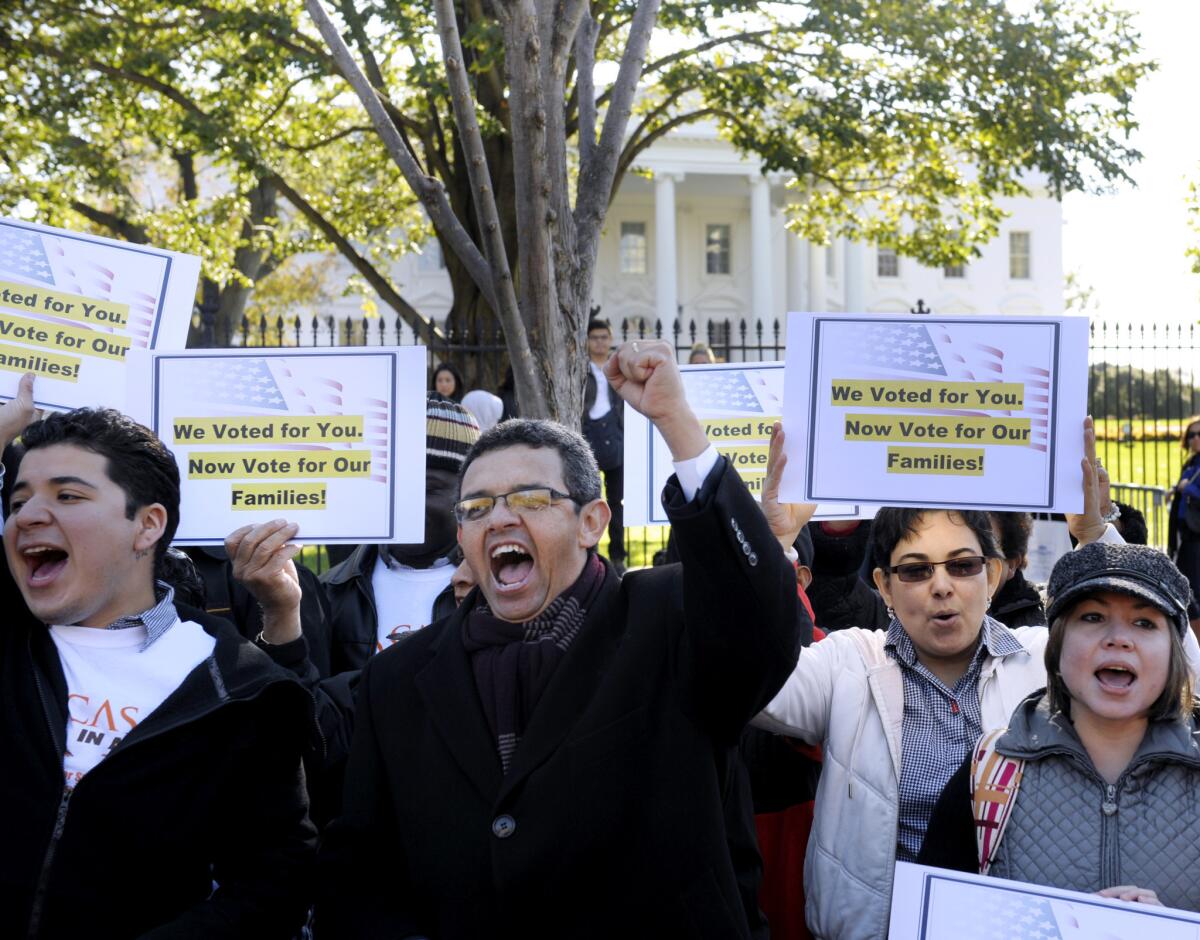 Gustavo Torres, director of Casa in Action, center, called on President Obama to fulfill his promise of passing comprehensive immigration reform during a rally in front of the White House in Washington D.C.