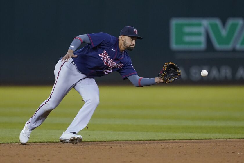 FILE - Minnesota Twins' Royce Lewis fields the ball during a baseball game against the Oakland Athletics in Oakland, Calif., May 16, 2022. Lewis will join the Twins in Houston for the start of a three-game series. The first pick in the 2017 draft will be reinstated from the 60-day injured list. (AP Photo/Jeff Chiu, File)