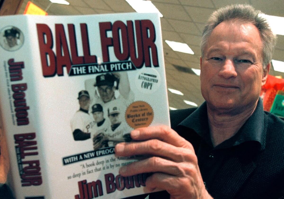 Former major league pitcher Jim Bouton signs copies of his book, "Ball Four: The Final Pitch," on November 27, 2000, in Schaumburg, Ill. The former New York Yankees pitcher who shocked and angered the conservative baseball world with the tell-all book “Ball Four,” has died.