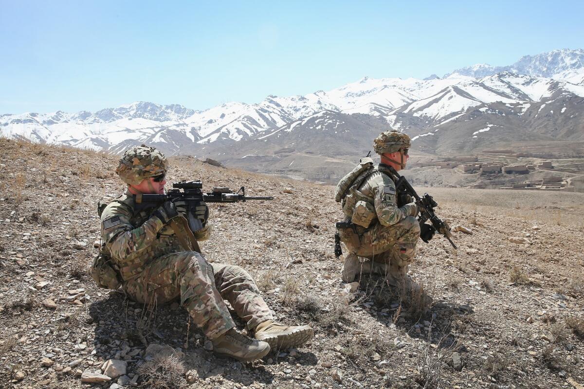 U.S. soldiers patrolling a mountainside in March near Pul-e Alam, Afghanistan.