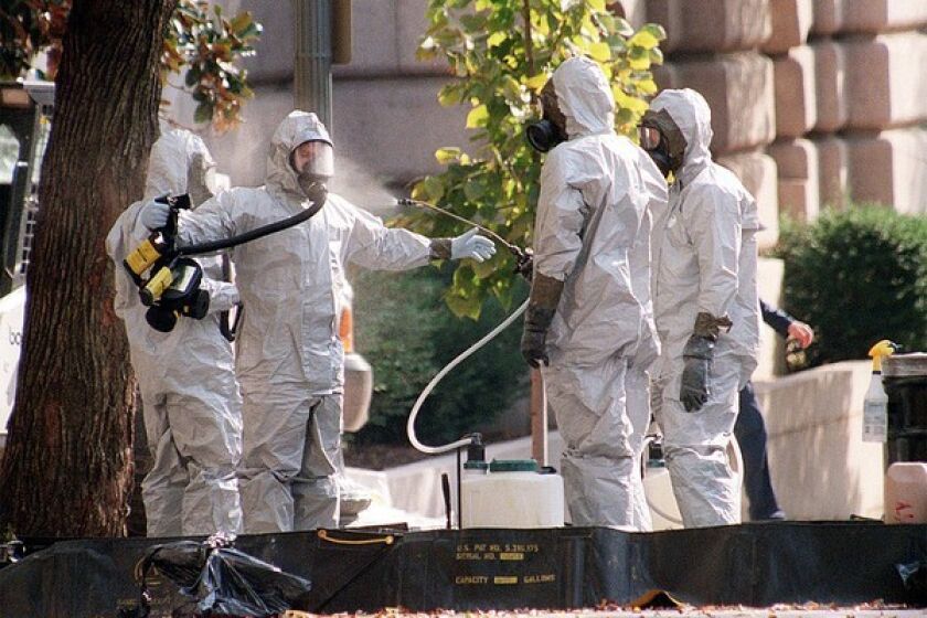 A hazmat worker is hosed off on Capitol Hill in October 2001 after anthrax-laced letters were sent to two senators. Five people ultimately died from the mailings, which were the work of Army scientist Bruce Ivins.