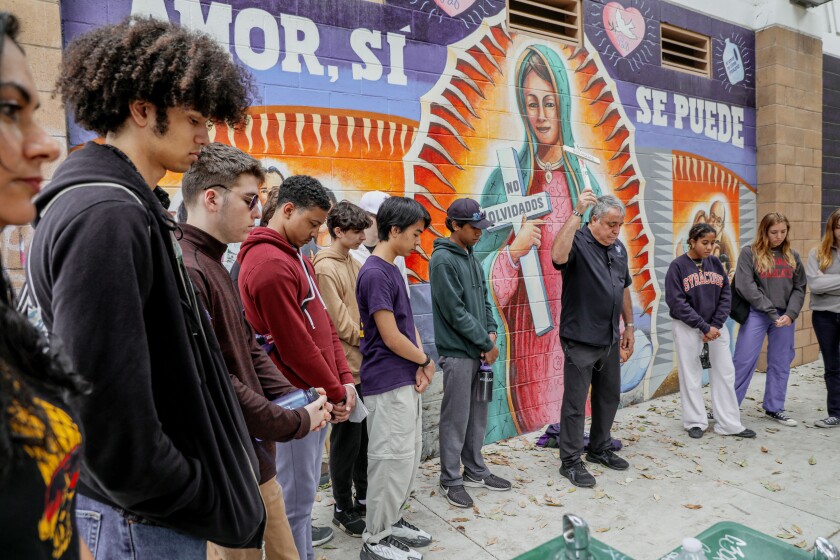 Activist Enrique Morones, with Gente Unida, leads a silent vigil.