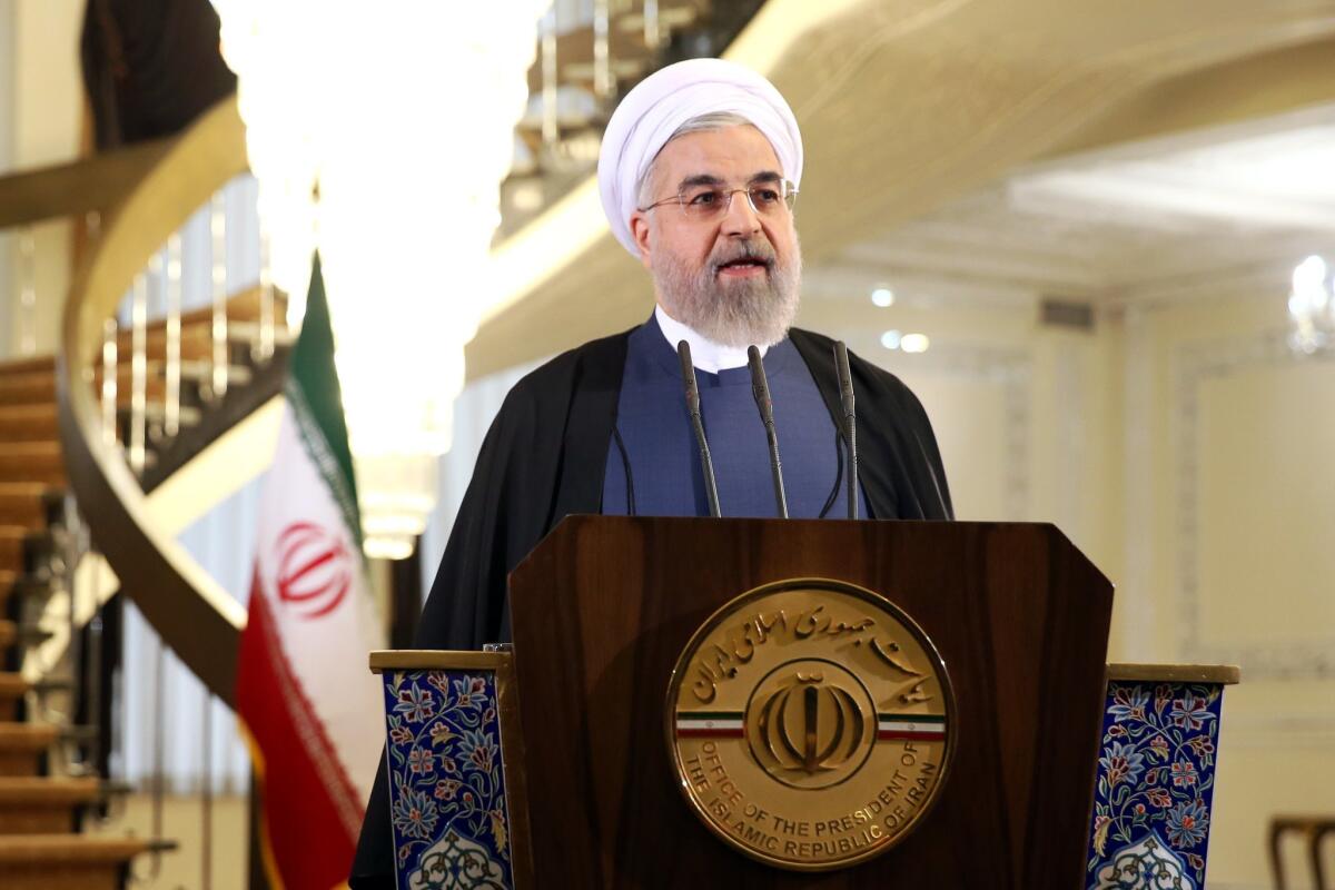 Iranian President Hassan Rouhani speaks in a news briefing at the Saadabad palace in Tehran on April 3. Rouhani pledged that his nation will abide by its commitments in the nuclear agreement reached the previous day in Switzerland.