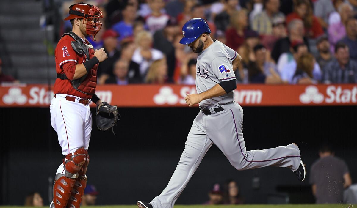 Rangers slugger Mitch Moreland scores against the Angels during a game last season.