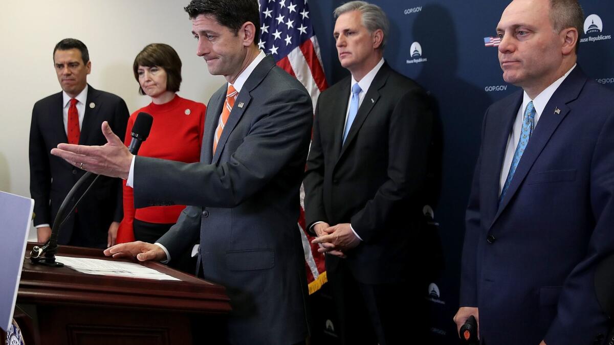 Speaker of the House Paul D. Ryan and other Republican House leaders answer reporters' questions at the Capitol on Tuesday.