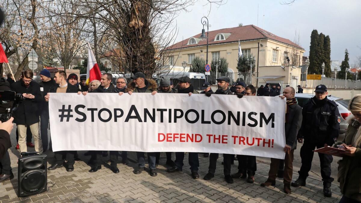 Protesters angry over a Netanyahu remark demonstrate outside the Israeli Embassy in Warsaw on Feb. 15. Poland passed a law that criminalized suggestions the country was responsible in any way for the Holocaust.