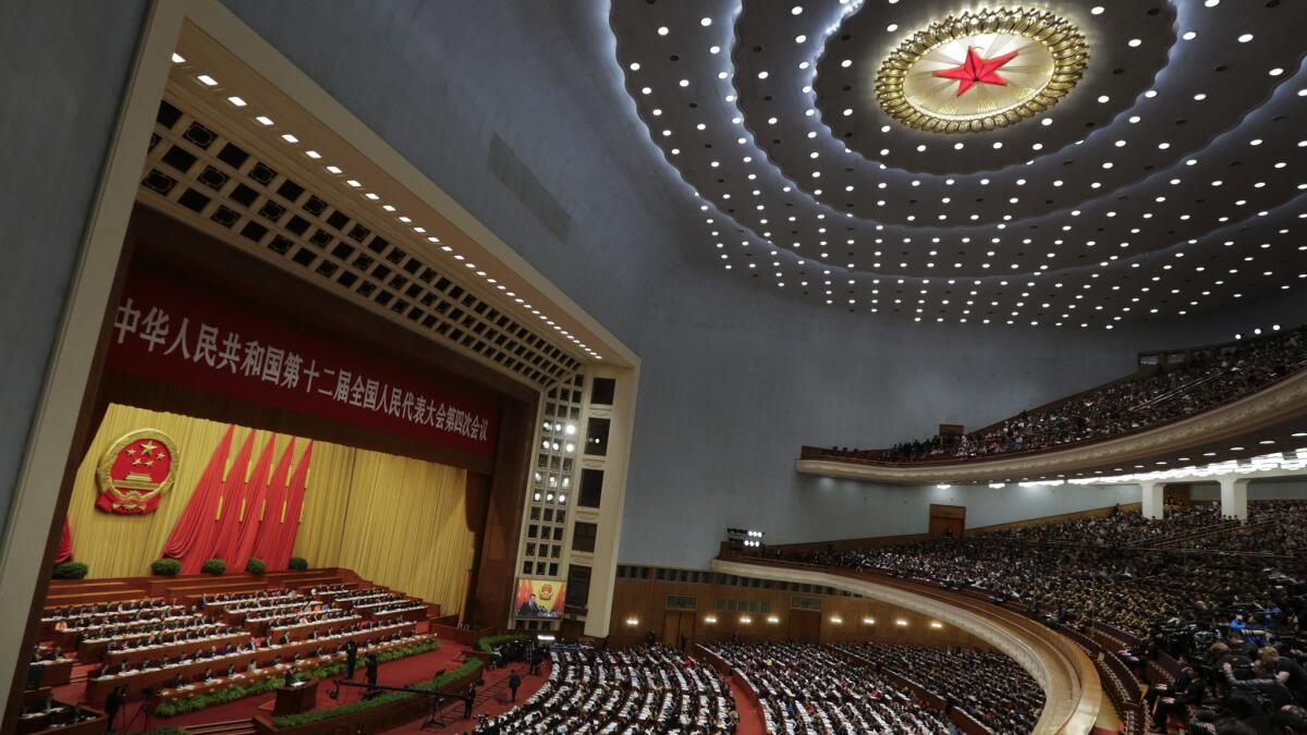 Chinese Premier Li Keqiang delivers a work report at the opening session of the annual National People's Congress at the Great Hall of the People in Beijing.