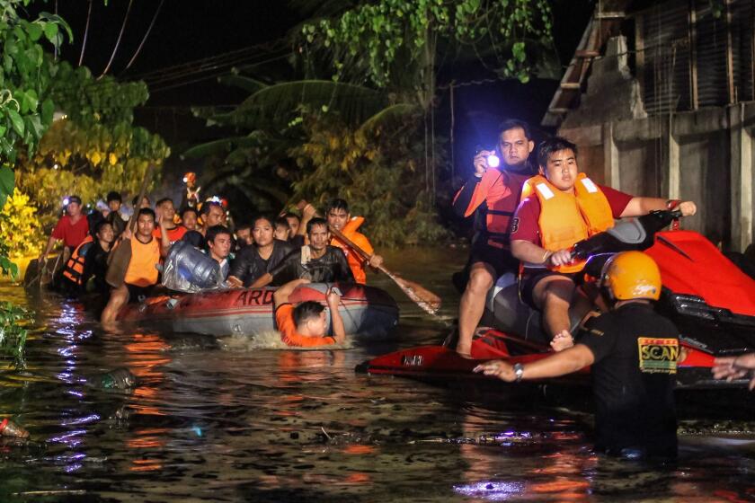 Rescue workers evacuate flood-affected residents in Davao on the southern Philippine island of Mindanao early on December 23, 2017, after Tropical Storm Tembin dumped torrential rains across the island. The death toll from the tropical storm that struck the southern Philippines has risen to 30 with five others missing, officials said on December 23. / AFP PHOTO / MANMAN DEJETOMANMAN DEJETO/AFP/Getty Images ** OUTS - ELSENT, FPG, CM - OUTS * NM, PH, VA if sourced by CT, LA or MoD **