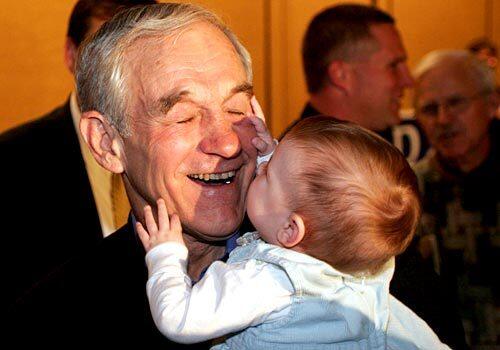 Republican presidential hopeful, Rep. Ron Paul, R-Texas, holds 8-month-old Maggie Brunson, for a photo, while greeting supporters in Columbia, S.C., following the conclusion of the Republican Primary, Saturday, Jan. 19, 2008.