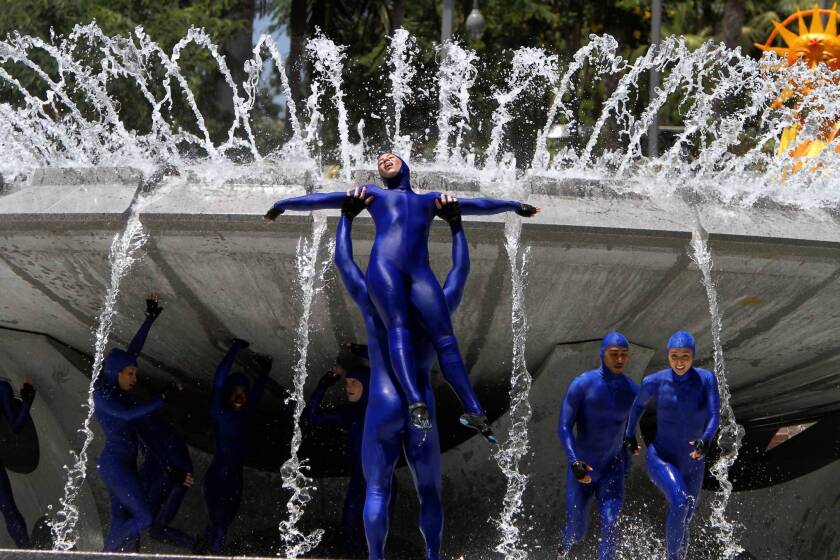 Dancers perform in the renovated Arthur J. Will Memorial Fountain during the grand opening of Grand Park in downtown Los Angeles.