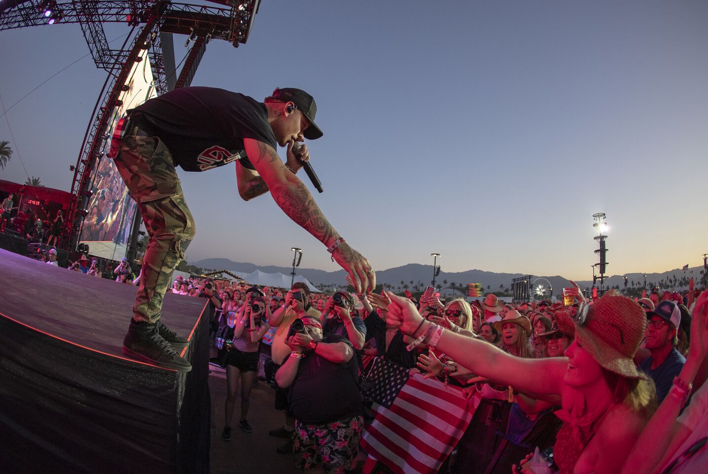Kane Brown greets a fan while performing on the Mane Stage on the first day of the three-day 2019 Stagecoach Country Music Festival.