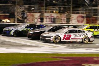 Daniel Suarez (99), left, edges out Kyle Busch (8), center, and Ryan Blaney (12) at the finish line.