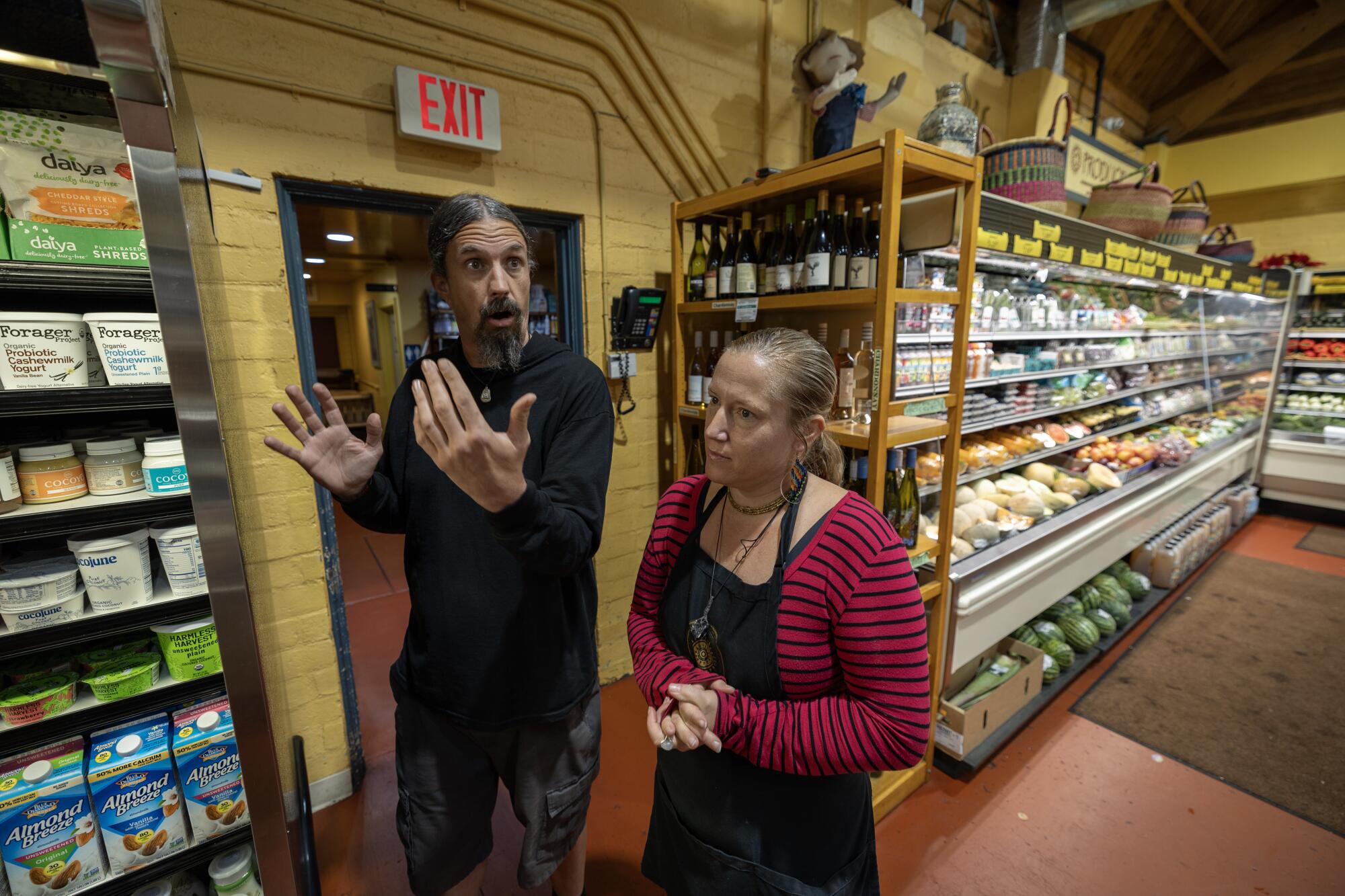 Andrew Shaw, left, manager, and Amy Allen, cashier, at Rainbow bridge natural 