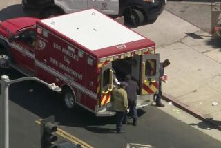 The victim of a stabbing in South Los Angeles is loaded into an LAFD ambulance for treatment of a neck wound on Aug. 30, 2024. (KTLA)