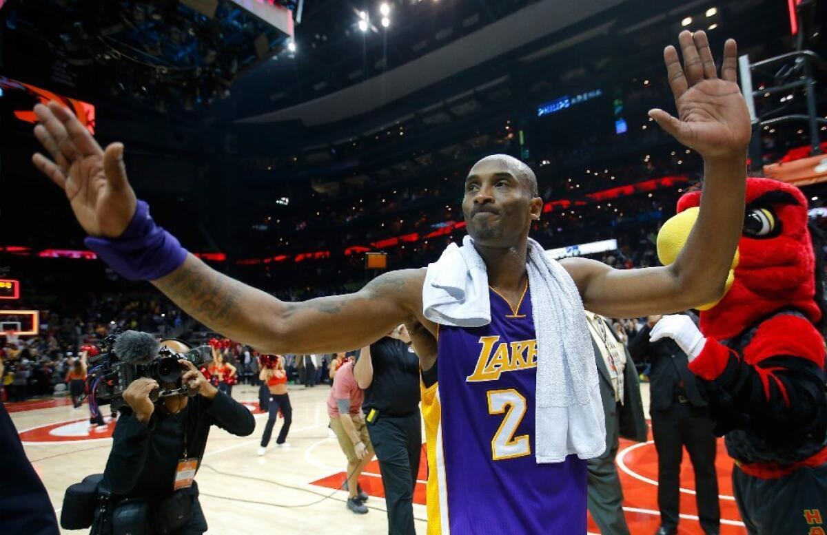 Kobe Bryant gestures to fans after the Lakers' 100-87 loss to the Atlanta Hawks on Dec. 4.