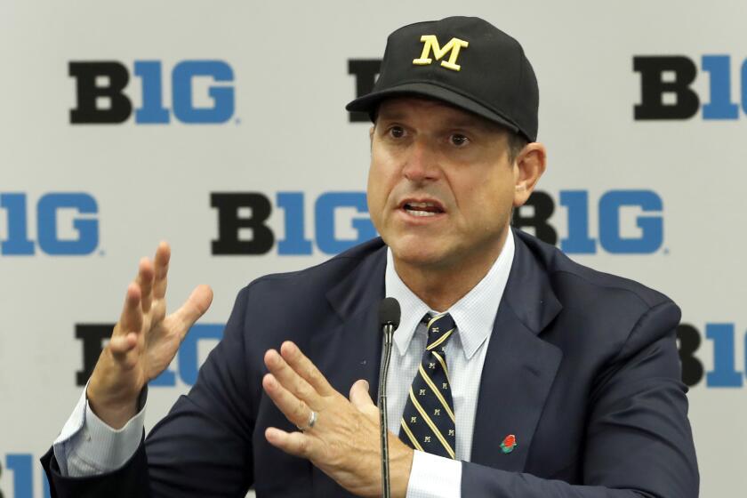 FILE - In this July 19, 2019, file photo, Michigan head coach Jim Harbaugh responds to a question during the Big Ten Conference NCAA college football media days in Chicago. The strength of Michigan's schedule is its balance. (AP Photo/Charles Rex Arbogast, File)