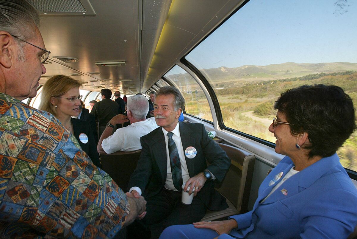 Will Kempton, then-director of the California Department of Transportation, greets dignitaries during a kickoff event for new train service to San Luis Obispo in 2004. Kempton, who is retiring, called the condition of the state's roads the worst he's ever seen.