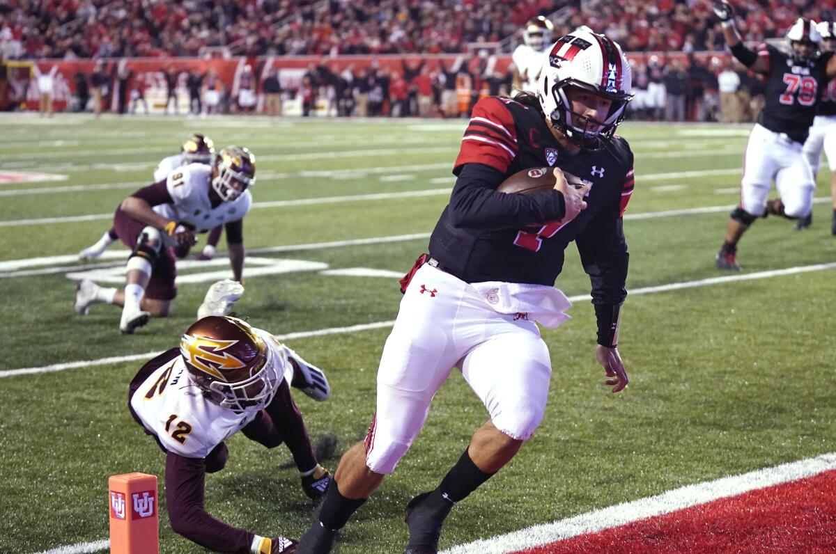 Utah quarterback Cameron Rising scores against Arizona State on Oct. 16, 2021.