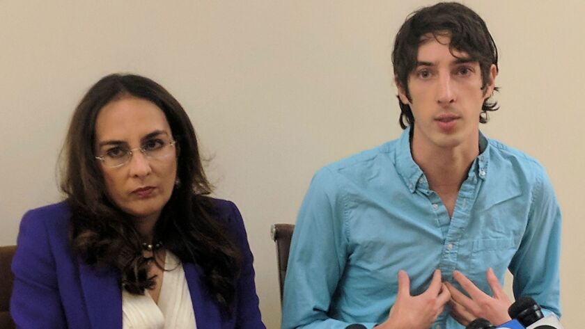 James Damore, right, who was fired by Google in 2017, speaks to reporters in January beside his attorney Harmeet Dhillon.