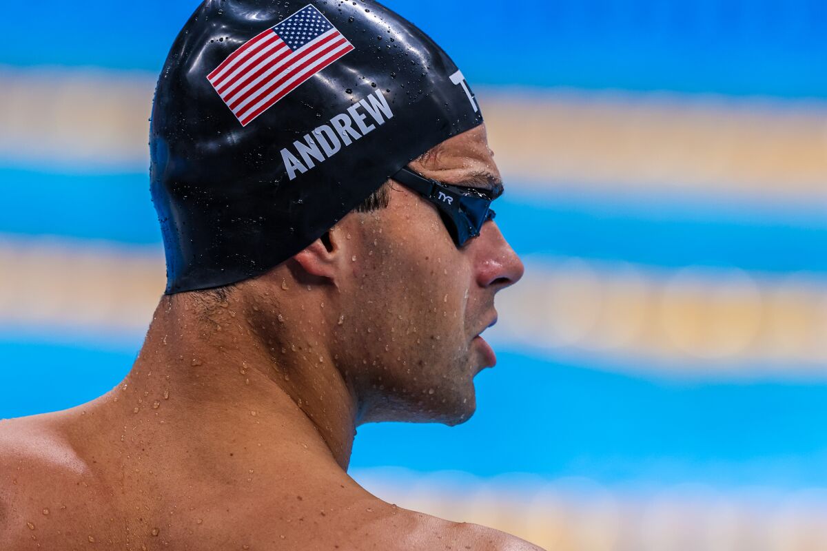 USA swimmer Michael Andrew warms up poolside before he competes.