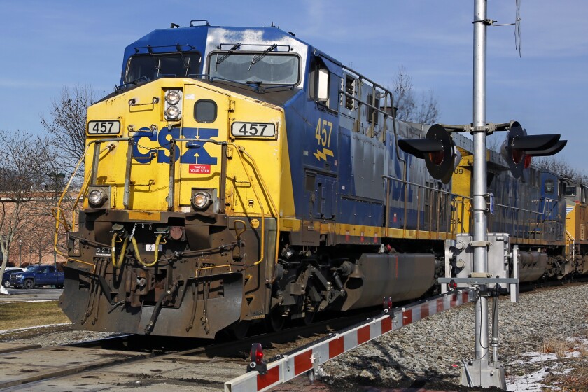 FILE - A CSX freight train passes through Homestead, Pa. Feb. 12, 2018. CSX railroad’s fourth-quarter profit jumped 23% even though volume slipped amid the ongoing supply chain challenges. The Jacksonville, Florida-based railroad said Thursday, Jan. 20, 2022 it earned $934 million, or 42 cents per share. (AP Photo/Gene J. Puskar, File)