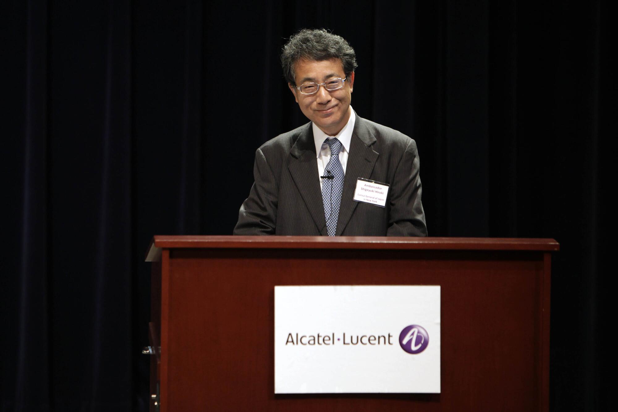 Japanese Ambassador Shigeyuki Hiroki speaks at a lectern