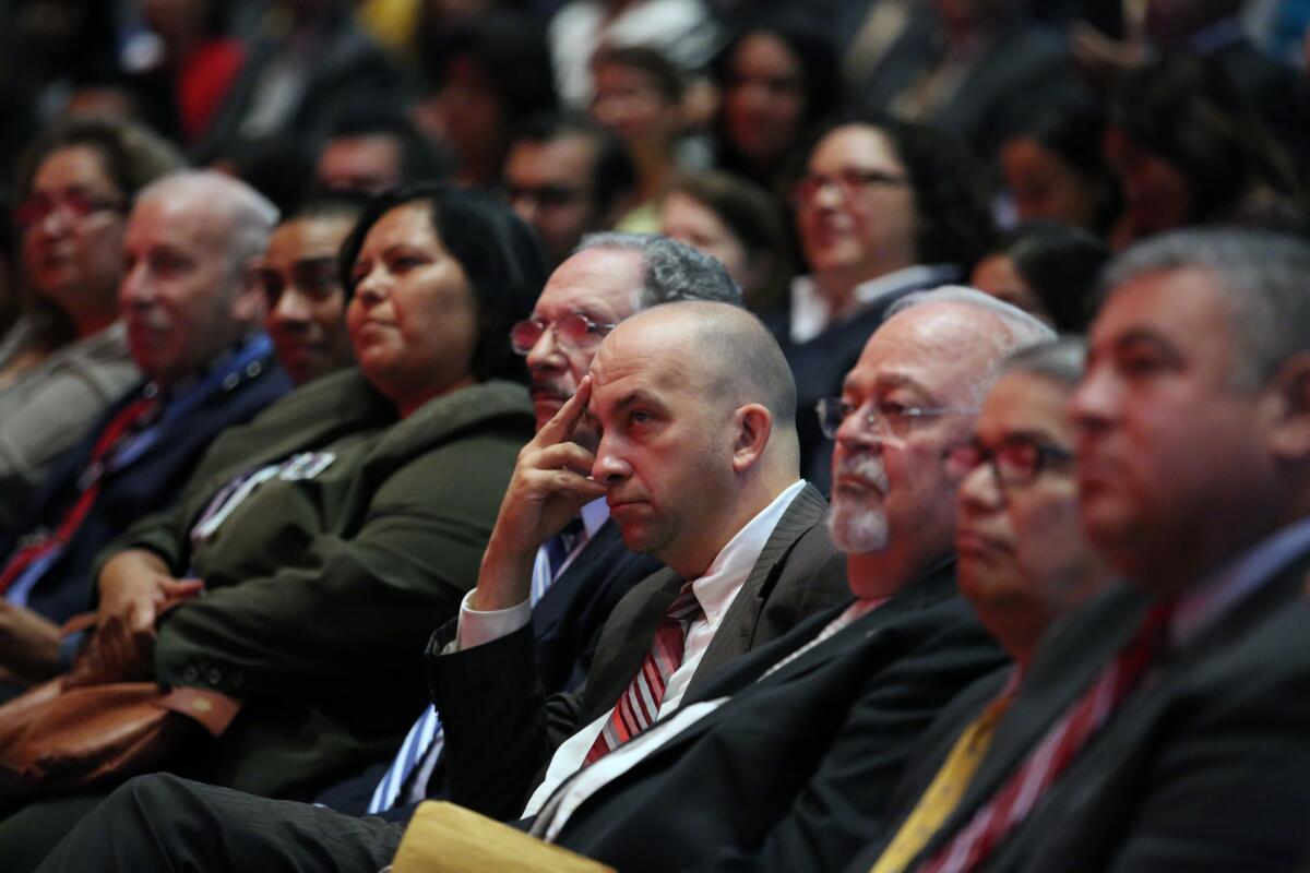 Los Angeles school board President Steve Zimmer, fourth from right, and other board members listen as schools Supt. Ramon C. Cortines delivers his annual welcoming speech at Garfield High School this month.