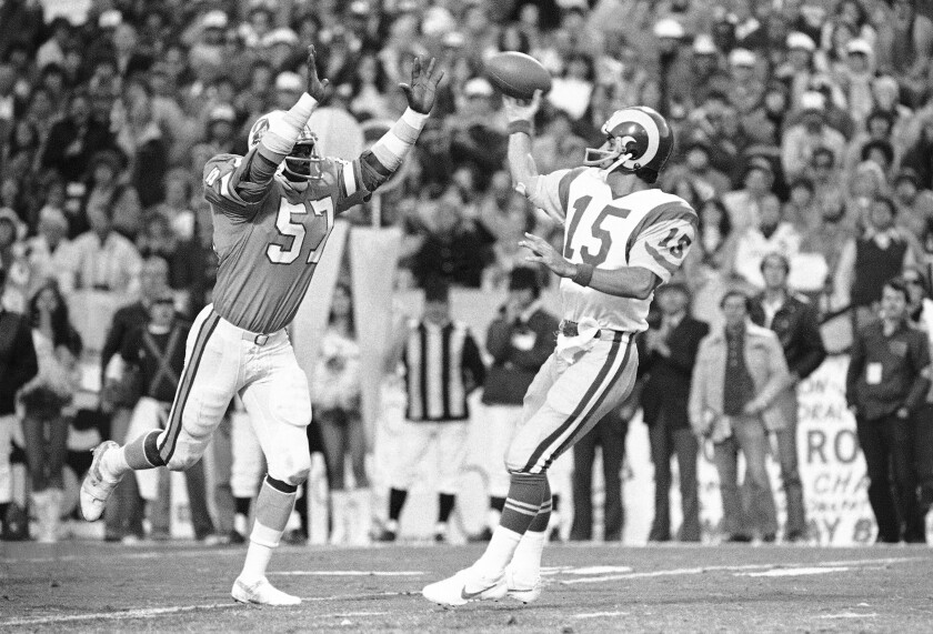 Tampa Bay Buccaneers' David Lewis pressures Rams quarterback Vince Ferragamo during the NFC championship game.