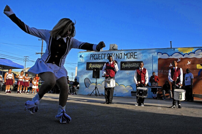 The Compton Sounders drill team performs during a program honoring of rapper-entrepenuer Dr. Dre.