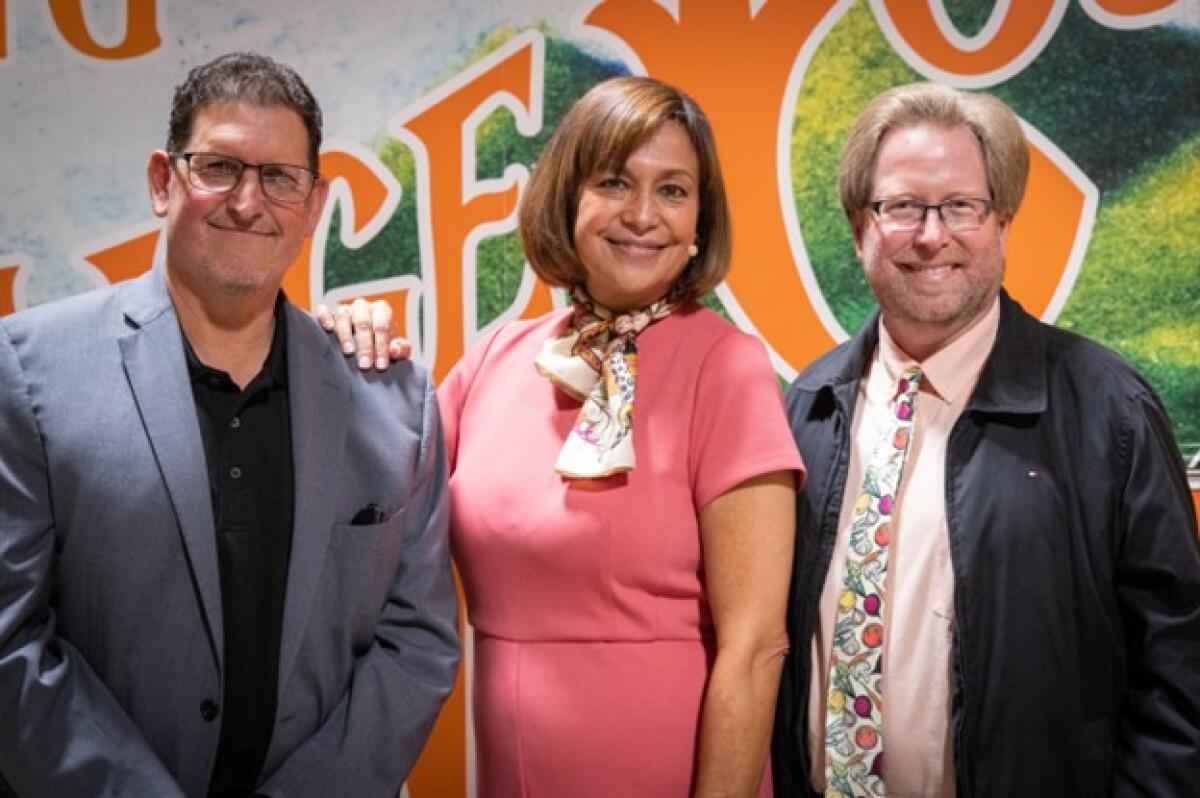 Mike Learakos, Claudia Bonilla Keller and Mark Lowry of Orange County Hunger Alliance.