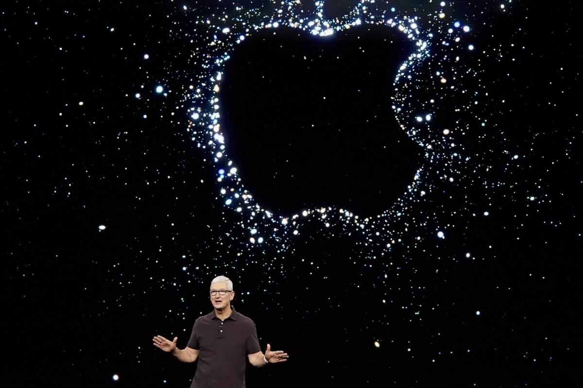 Apple CEO Tim Cook speaks at an event at the company's headquarters in Cupertino, Calif.