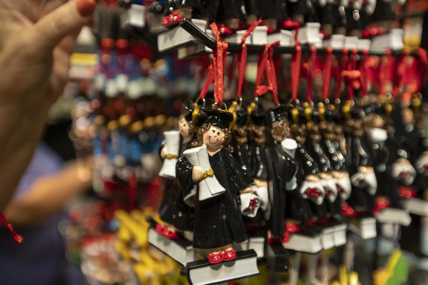 Graduate ornaments are one of the many arts and crafts items for sale at the Harvest Festival at the OC Fair & Event Center.