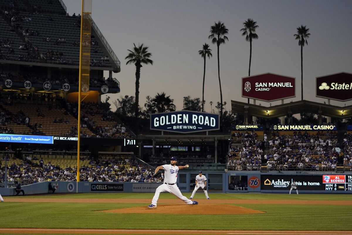 Dodgers starting pitcher Clayton Kershaw throws during the first inning.