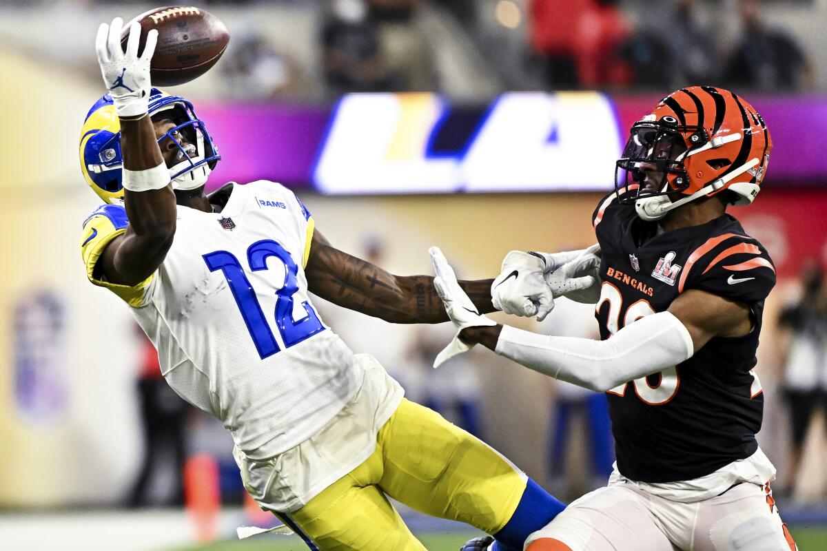 Rams receiver Van Jefferson pulls in a pass during Super Bowl LVI against the  Bengals and cornerback Eli Apple (20).