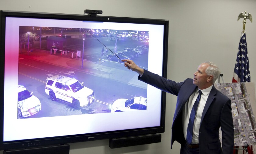 Scott Lang, Virginia Beach Chief Deputy Commonwealth Attorney, explains footage from police worn body cameras during a press conference, Tuesday, Nov, 30, 2021, in Virginia Beach, Va., about the police involved shooting of Donovon Lynch last March. (Stephen Katz/The Virginian-Pilot via AP)
