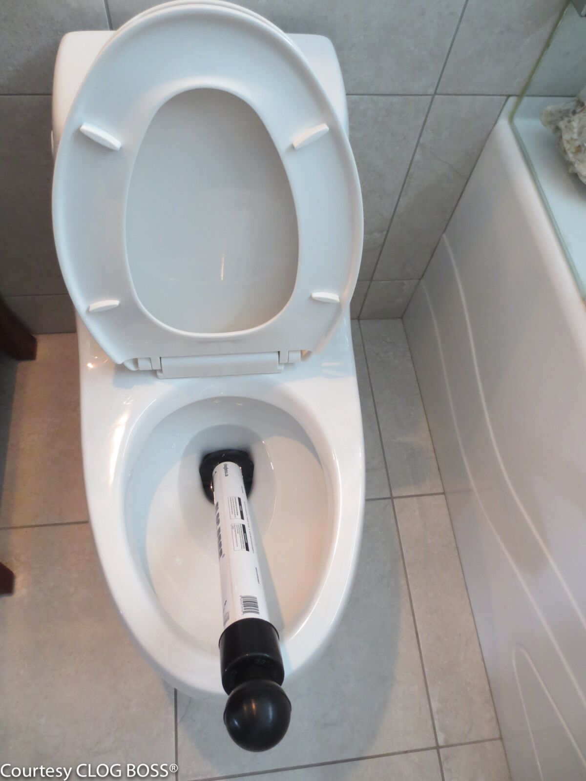 CLOG BOSS ready to clear a toilet clog