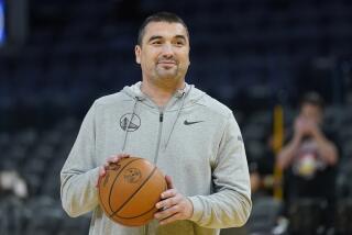 Golden State Warriors assistant coach Dejan Milojevic smiles during an NBA preseason basketball game