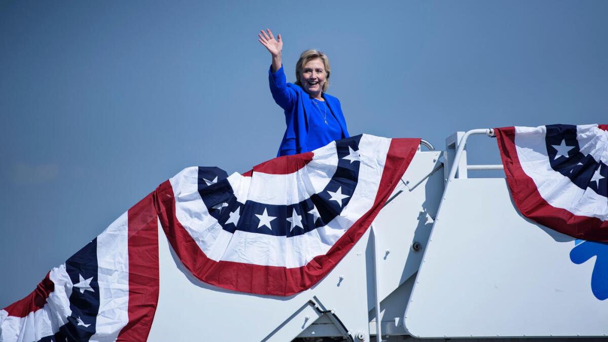 Hillary Clinton boards her plane at Charlotte Douglas International Airport while campaigning in Charlotte, N.C., on Sept. 8.